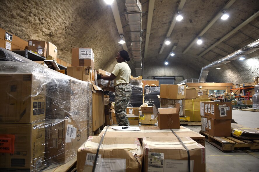 Tech. Sgt. Reshema Ford, a 386th Expeditionary Logistics Readiness Squadron inbound cargo NCO in charge, sorts cargo at an undisclosed location in Southwest Asia, March 22, 2016. The deployment and distribution flight receives and processes an average of 150 tons of inbound cargo each month. (U.S. Air Force photo by Staff Sgt. Jerilyn Quintanilla)