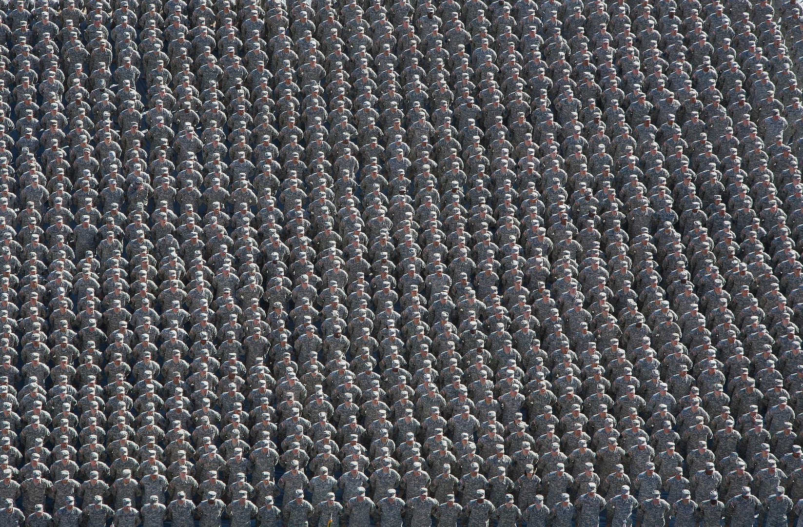 Arizona National Guard Soldiers from the 158th Maneuver Enhancement Brigade stand in formation on the field at Arizona State University's Sun Devil Stadium, Dec. 7, 2014 in Tempe, Ariz.  The formation, which was part of the Arizona National Guard Muster and Community Expo, was the first time in over a century Arizona Soldiers and Airmen assembled together in mass formation.