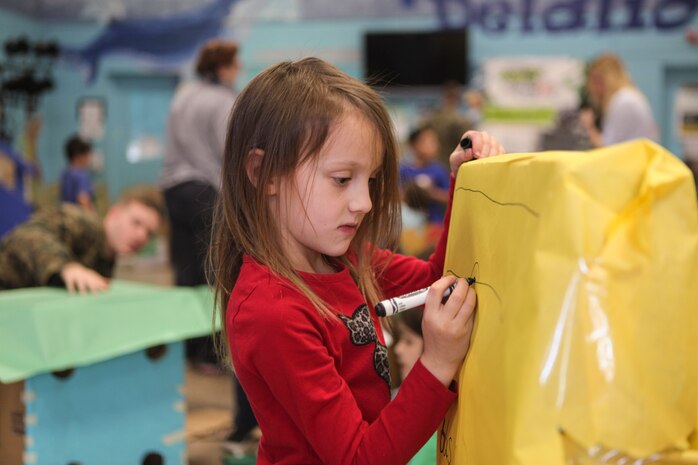 Students at DeLalio Elementary School participate in the Cardboard Box Challenge, a global Science, Technology, Engineering and Math education event, March 10. After creating an arcade out of cardboard and other recyclable materials, the students invited friends in family to come play the games.
