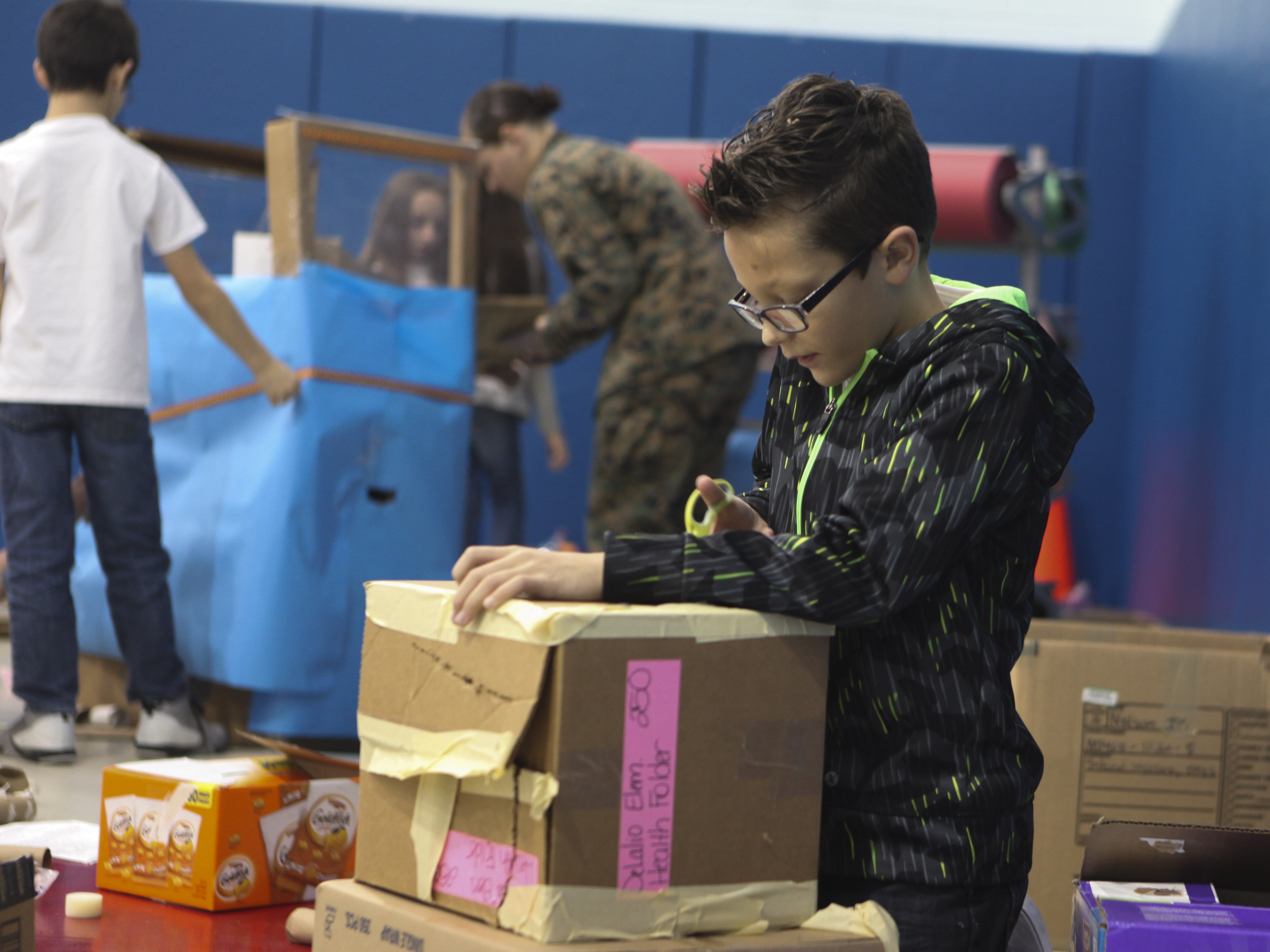 DeLalio holds Cardboard Box Challenge
