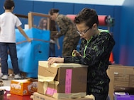 Students at DeLalio Elementary School participate in the Cardboard Box Challenge, a global Science, Technology, Engineering and Math education event, March 10. After creating an arcade out of cardboard and other recyclable materials, the students invited friends in family to come play the games.
