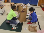 Students at DeLalio Elementary School participate in the Cardboard Box Challenge, a global Science, Technology, Engineering and Math education event, March 10. After creating an arcade out of cardboard and other recyclable materials, the students invited friends in family to come play the games.
