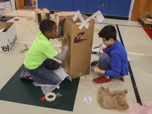 Students at DeLalio Elementary School participate in the Cardboard Box Challenge, a global Science, Technology, Engineering and Math education event, March 10. After creating an arcade out of cardboard and other recyclable materials, the students invited friends in family to come play the games.
