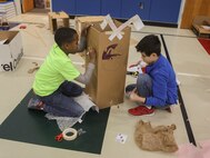 Students at DeLalio Elementary School participate in the Cardboard Box Challenge, a global Science, Technology, Engineering and Math education event, March 10. After creating an arcade out of cardboard and other recyclable materials, the students invited friends in family to come play the games.
