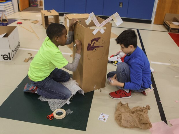 Students at DeLalio Elementary School participate in the Cardboard Box Challenge, a global Science, Technology, Engineering and Math education event, March 10. After creating an arcade out of cardboard and other recyclable materials, the students invited friends in family to come play the games.
