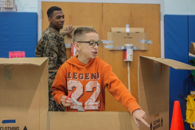 Students at DeLalio Elementary School participate in the Cardboard Box Challenge, a global Science, Technology, Engineering and Math education event, March 10. After creating an arcade out of cardboard and other recyclable materials, the students invited friends in family to come play the games.
