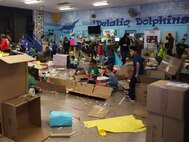 Students at DeLalio Elementary School participate in the Cardboard Box Challenge, a global Science, Technology, Engineering and Math education event, March 10. After creating an arcade out of cardboard and other recyclable materials, the students invited friends in family to come play the games.
