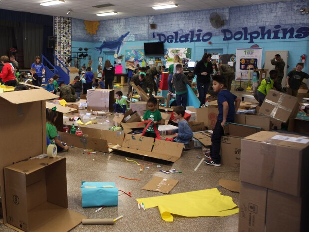 Students at DeLalio Elementary School participate in the Cardboard Box Challenge, a global Science, Technology, Engineering and Math education event, March 10. After creating an arcade out of cardboard and other recyclable materials, the students invited friends in family to come play the games.
