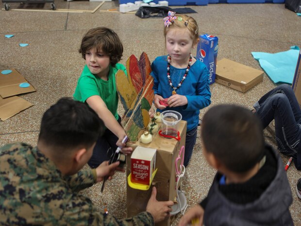 Students at DeLalio Elementary School participate in the Cardboard Box Challenge, a global Science, Technology, Engineering and Math education event, March 10. After creating an arcade out of cardboard and other recyclable materials, the students invited friends in family to come play the games.
