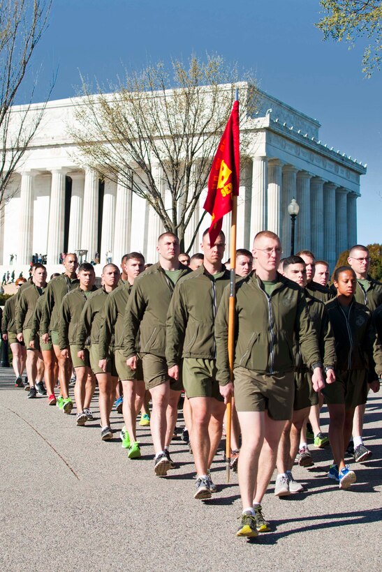 Marines from the Staff Noncommissioned Officer Academy march past the Lincoln Memorial. The group of students sang cadences while running through the National Mall and listened to a narrative at each memorial visited.