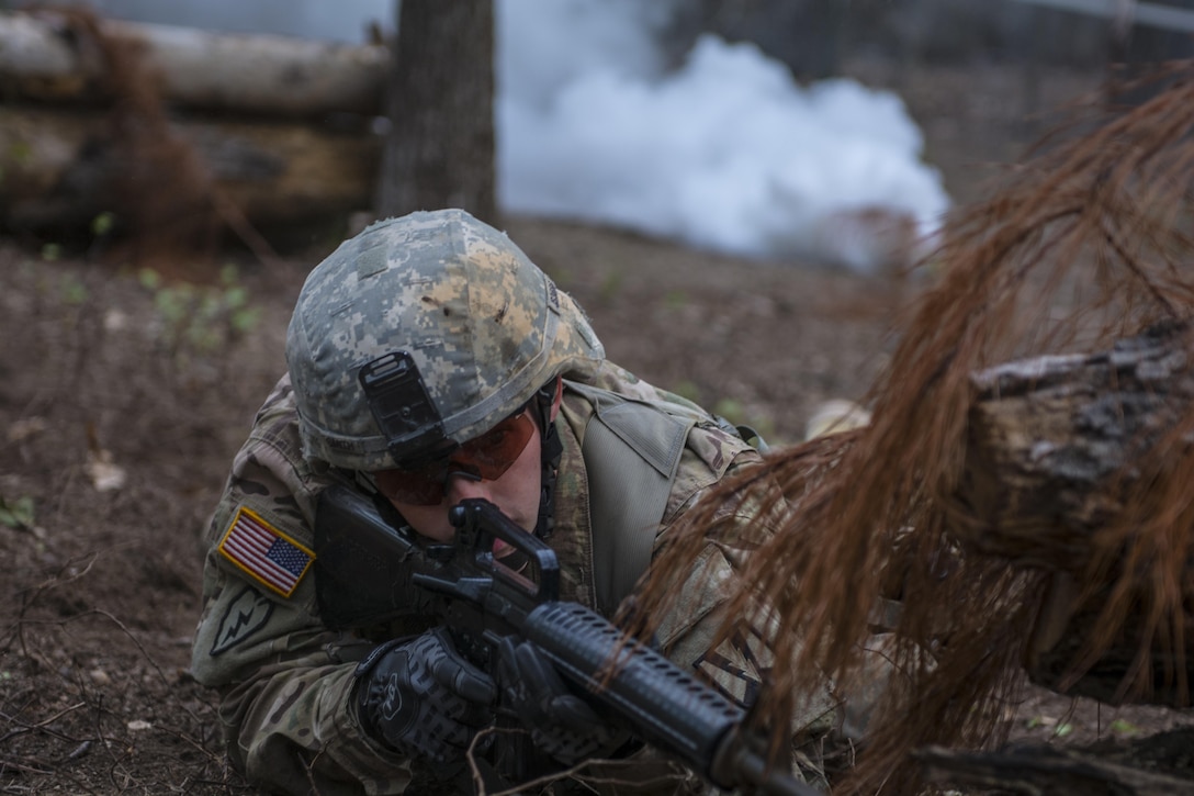 Staff Sgt. James Smith, 3rd Bn., 39th Inf. Reg., scans the terrain while searching for his next position while taking direct fire during Expert Infantry Badge testing held at Ft. Jackson, S.C., March 31, 2016. Soldiers vying for the coveted Infantry qualification were given 30 timed Army Warrior tasks to complete in addition to being tested on the Army Physical Fitness test, day and night land navigation. Testing ends on April 1 with a 12-mile forced march. (U.S. Army photo by Sgt. 1st Class Brian Hamilton/released)