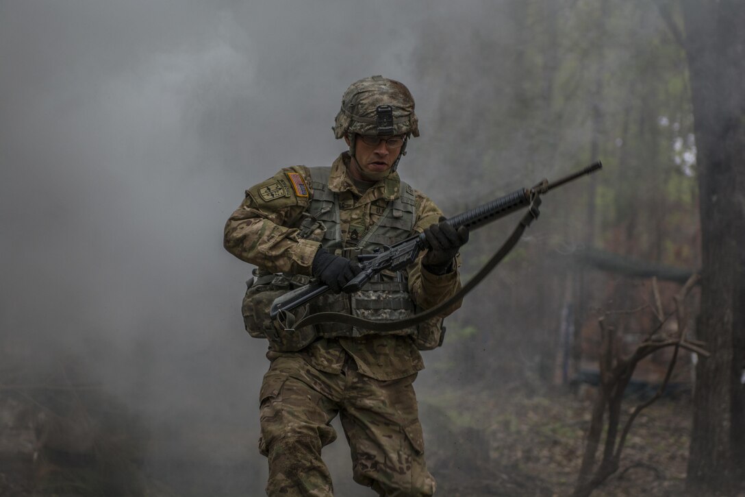 Sgt. 1st Class Dennis Henning, Co. B, 2nd Bn. 13th Inf. Reg., uses a three second rush to bound to his next firing point while taking direct fire during Expert Infantry Badge testing held at Ft. Jackson, S.C., March 31, 2016. Soldiers vying for the coveted Infantry qualification were given 30 timed Army Warrior tasks to complete in addition to being tested on the Army Physical Fitness test, day and night land navigation. Testing ends on April 1 with a 12-mile forced march. (U.S. Army photo by Sgt. 1st Class Brian Hamilton/released)