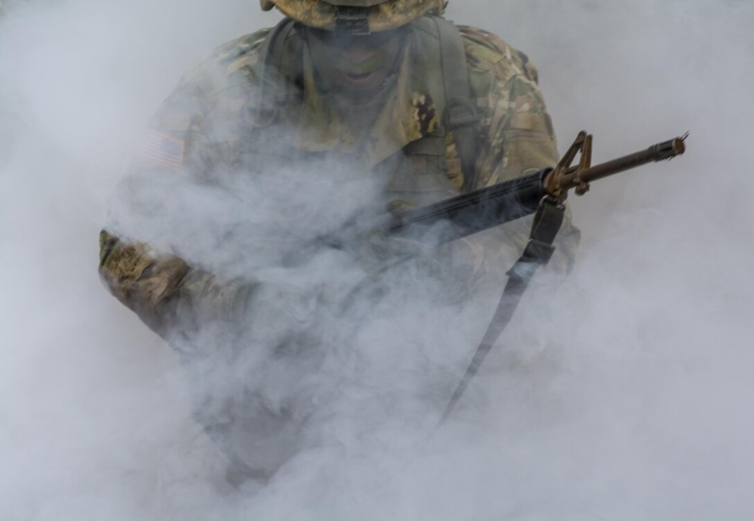 Staff Sgt. Tobias Henry, Special Troops Bn., 171st Inf. Bde., uses a three second rush to bound to an alternate firing point while reacting to direct fire during Expert Infantry Badge qualifications held at Ft. Jackson, S.C., March 31, 2016. Soldiers vying for the coveted Infantry qualification were given 30 timed Army Warrior tasks to complete in addition to being tested on the Army Physical Fitness test, day and night land navigation. Testing ends on April 1 with a 12-mile forced march. (U.S. Army photo by Sgt. 1st Class Brian Hamilton/released)