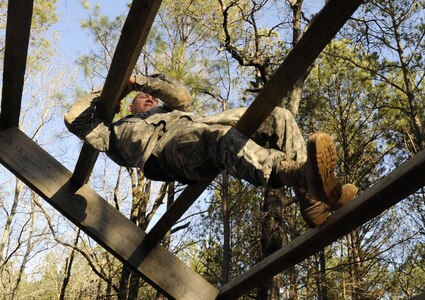 U.S. Army Spc. Kyle K. Meheula of Kalihi, Hawaii, a mechanic with the 642nd Regional Support Group, navigates an obstacle during the 642nd Regional Support Group's Best Warrior Competition at Fort McClellan, Ala., Feb. 18. (U.S. Army photo by Sgt. 1st Class Gary A. Witte, 642nd Regional Support Group)