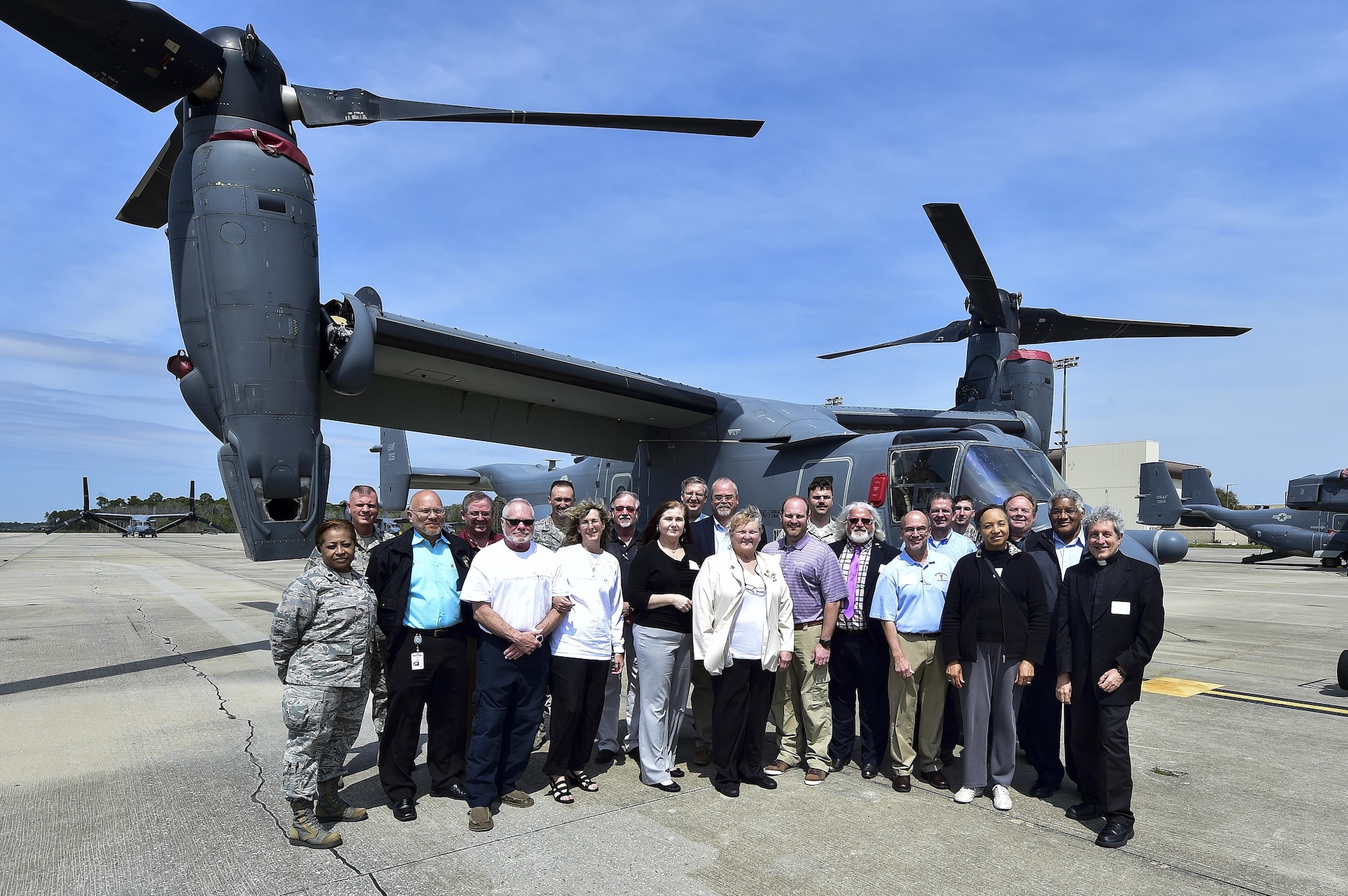 Local clergy and faith leaders stand in front of a CV-22B Osprey during an annual Clergy Day at Hurlburt Field, Fla., March 29, 2016. Clergy Day is an event when local clergy members and faith leader are invited to Hurlburt to receive information on topics that could affect military members of their churches. (U.S. Air Force photo by Senior Airman Jeff Parkinson)