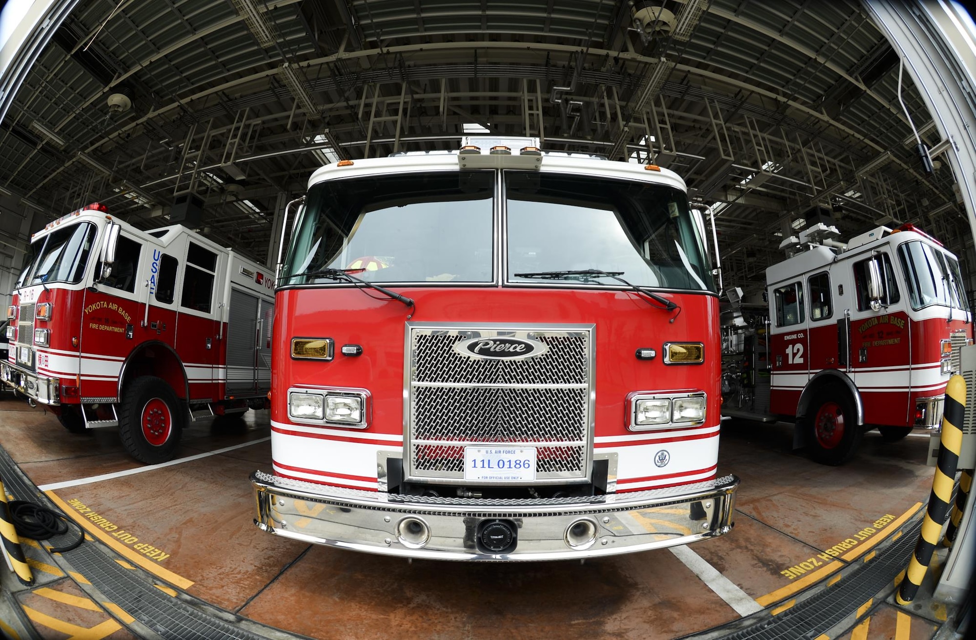 Fire Trucks with the 374th Civil Engineer Squadron fire and emergency services flight are parked at Yokota Air Base, Japan, March 30, 2016. The 374th CES/FEF performs daily checks on the trucks to ensure efficient function during emergencies. (U.S. Air Force photo by Airman 1st Class Elizabeth Baker/Released)
