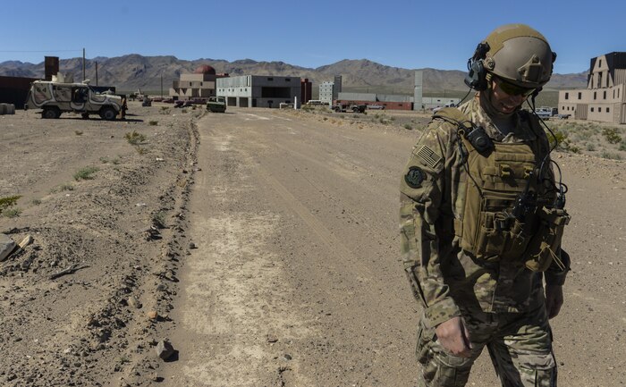 Capt. Richard Waters, 605th Test and Evaluation Squadron, Hurlburt Field, Florida, tactical air control party air liaison officer, joint terminal attack controller, returns to the truck after the operational assessment of the Hand Held Link 16 radio March 23, 2016, at the Nevada Test and Training Range. This operational assessment is only the first of many that the new HHL16 radio will undergo during its improvement period. (U.S. Air Force photo by Airman 1st Class Nathan Byrnes)