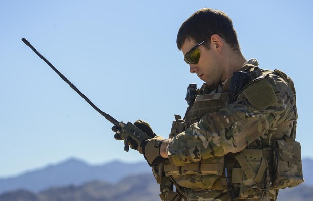 A joint terminal attack controller checks his radio before the start of the operational assessment of the Hand Held Link 16 radio March 23, 2016, at the Nevada Test and Training Range. The operational assessment of the HHL16 and the data collected during the assessment will help with the development and timely integration of the device. (U.S. Air Force photo by Airman 1st Class Nathan Byrnes)