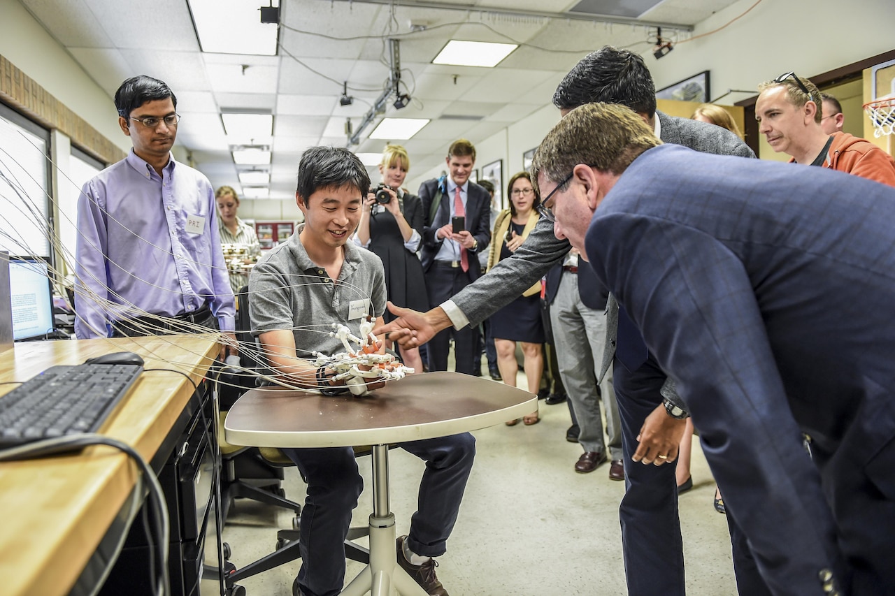 Defense Secretary Ash Carter, right, watches a robotics demonstration during a tour of the Rehabilitation and Neuromuscular Robotics Lab at the University of Texas at Austin, March 31, 2016. The Texas visit was part of a multistate trip that also included a stop today in Cambridge, Mass., and is part of the DoD effort to partner with the private sector and academia to ensure the United States continues to lead in the new frontiers of technology. DoD photo by Army Sgt. 1st Class Clydell Kinchen