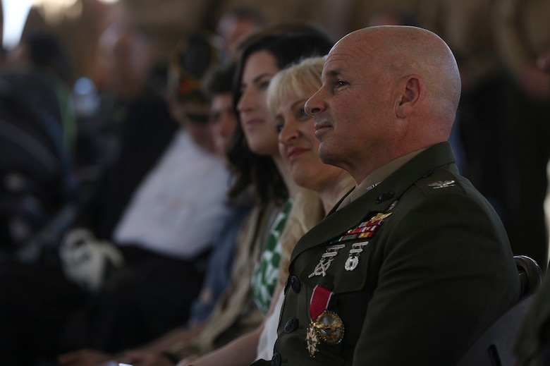 MARINE CORPS BASE CAMP PENDLETON, Calif. – Colonel Willard ‘Willy’ Buhl listens to guests speak about his retirement ceremony on Feb. 12, at Camp Pendleton, Calif. The ceremony was to commemorate Buhl’s 34 years of dedicated service to the United States Marine Corps. Buhl was formerly the director of Expeditionary Operations Training Group, I Marine Expeditionary Force and is from Los Gatos, Calif. (U.S. Marine Corps photo by Cpl. Angel Serna/Released)