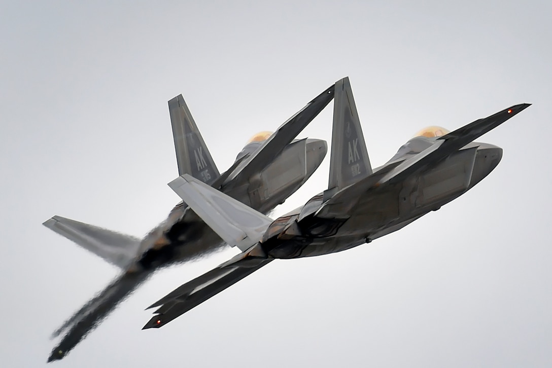 Two F-22 Raptors conduct approach training over Joint Base Elmendorf-Richardson, Alaska, March 24, 2016. Air Force photo by Justin Connaher