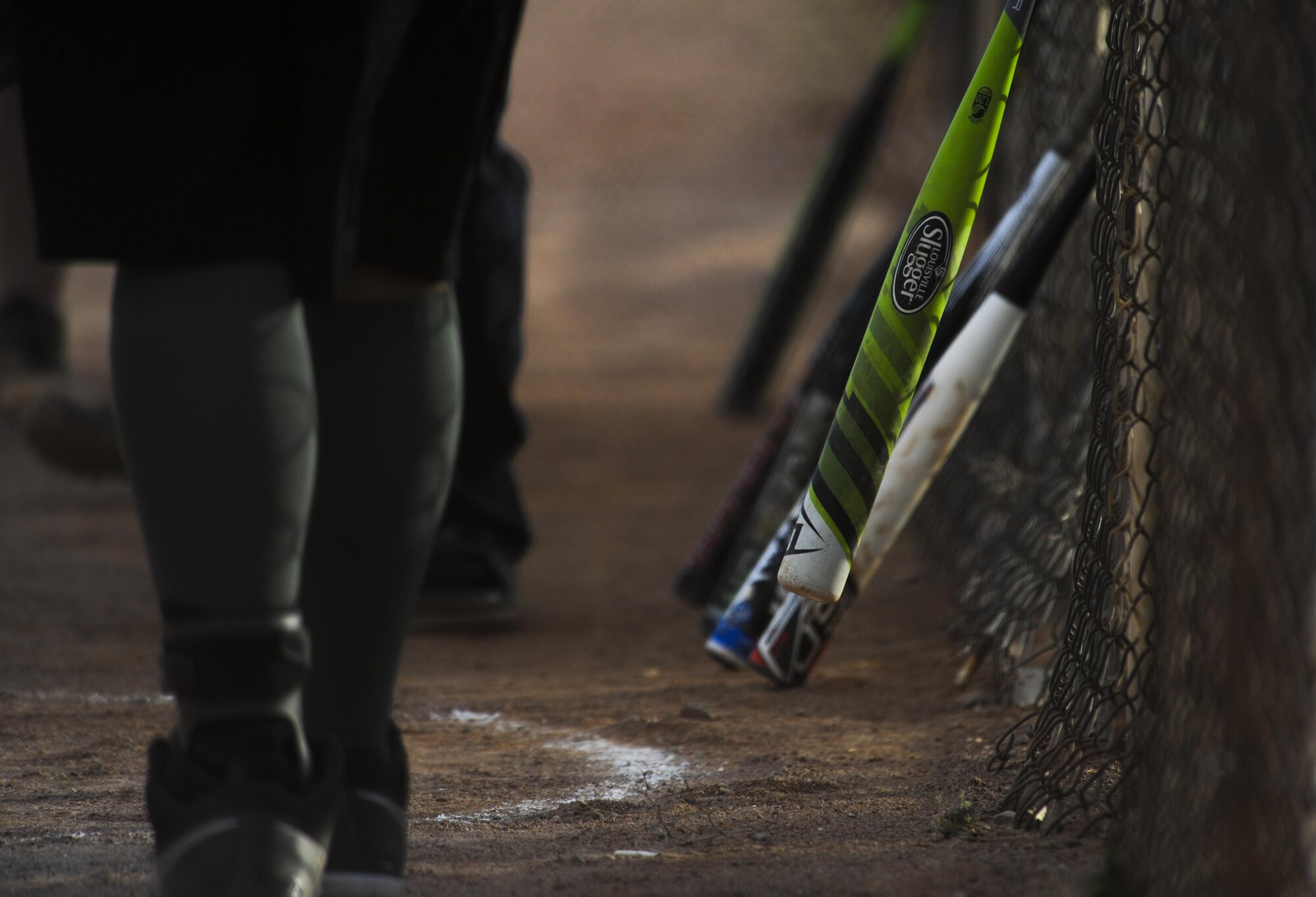 Bats hang on the fence of the softball field before an intramural game between 57th Operations Support Squadron and 30th Reconnaissance Squadron at Nellis Air Force Base, Nev., March 28, 2016. On March 14, Nellis AFB kicked off the intramural softball season where 14 teams from around the base will compete to see who can call themselves the champions. (U.S. Air Force photo by Airman 1st Class Kevin Tanenbaum)