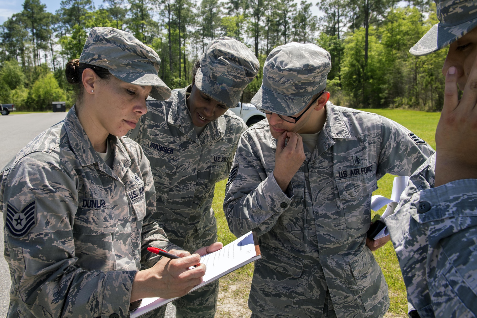 Members of the 23d Aerospace Medicine Squadron’s bioenvironmental engineering flight answer test questions during a radiological response exercise, March 30, 2016, at Moody Air Force Base, Ga. The 23d Civil Engineer Squadron’s emergency management specialists and bio flight collaborate with this joint exercise to employ homeland defense and expeditionary detection equipment in realistic scenarios. (U.S. Air Force photo by Airman 1st Class Greg Nash/Released) 
