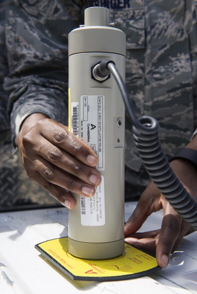 U.S. Air Force Staff Sgt. Juawana Stringer, 23d Aerospace Medicine Squadron bioenvironmental engineering flight NCO in charge of occupational health, surveys radiation ranges from an X-ray scintillator probe during a radiological response exercise, March 30, 2016, at Moody Air Force Base, Ga. The bio flight is responsible for protecting Moody’s vicinity, personnel and assets from chemical, biological, radiological and nuclear contamination as well as many illnesses. (U.S. Air Force photo by Airman 1st Class Greg Nash/Released)   

