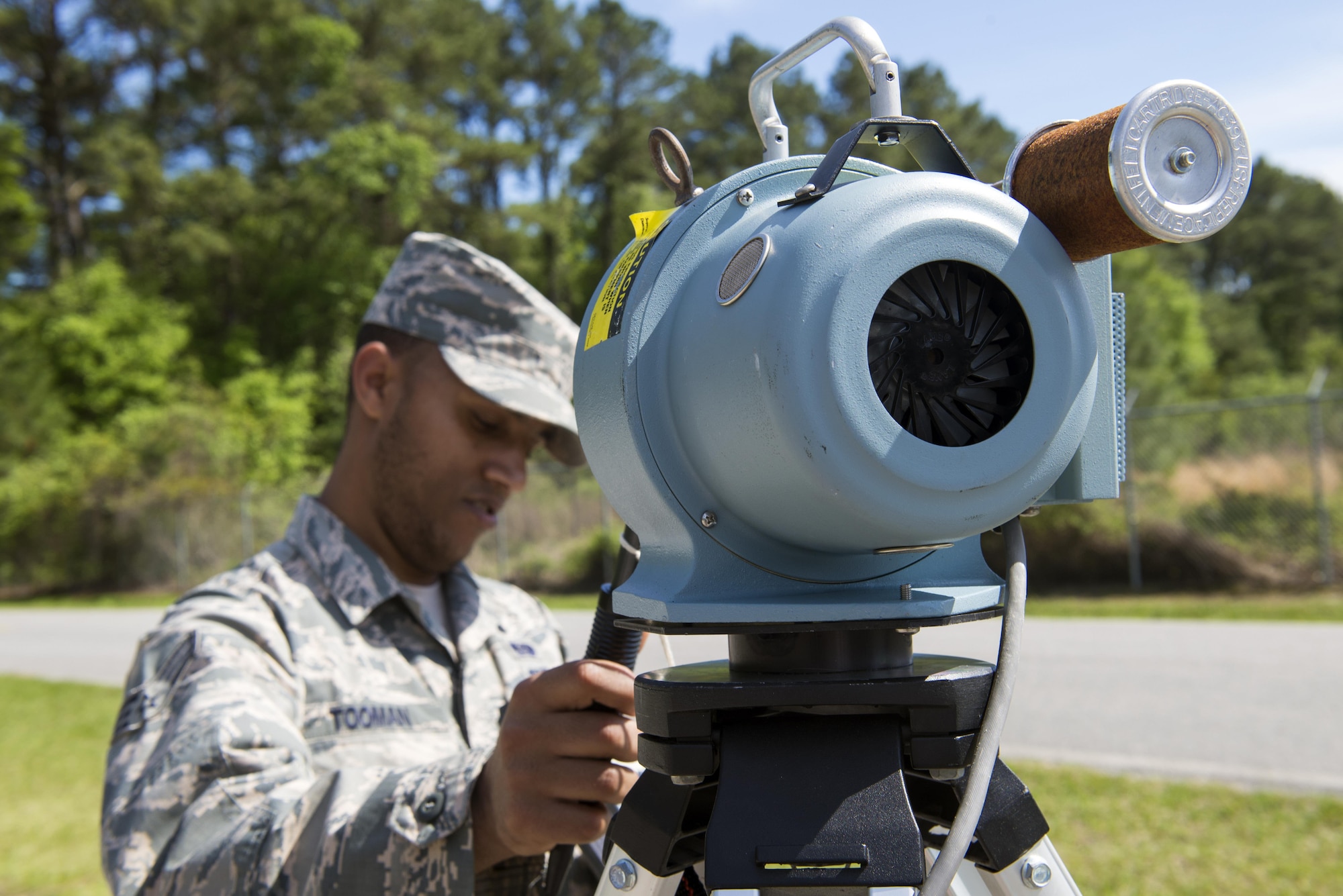 U.S. Air Force Senior Airman Matthias Tooman, 23d Civil Engineer Squadron emergency manager, filters an air sampler during a radiological response exercise, March 30, 2016, at Moody Air Force Base, Ga. The sampler sucks in air to collect possible radioactive particles to ensure the area is not hazardous. (U.S. Air Force photo by Airman 1st Class Greg Nash/Released)
