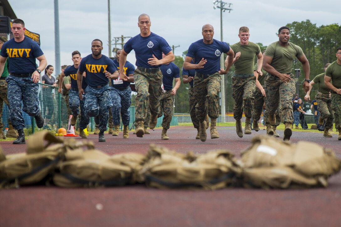Marines and sailors compete in the first annual Commanding General’s Fitness Cup Challenge on Parris Island, S.C., March 25, 2016, to promote a healthy lifestyle and lifelong commitment to fitness. During the challenge, teams competed in an obstacle course, endurance run, combat fitness test and team challenge. Marine Corps photo by Sgt. Jennifer Schubert