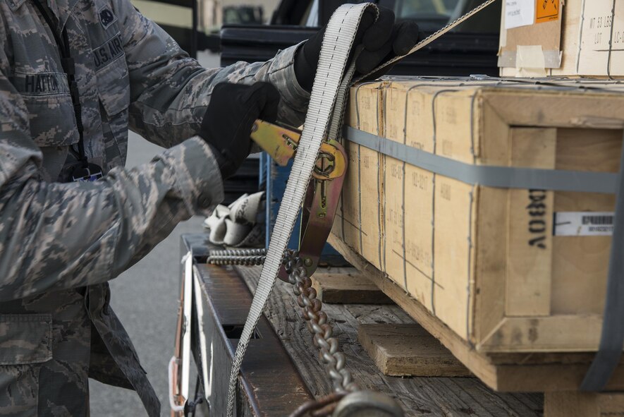 U.S. Air Force Airman 1st Class Bryce Hatton, 23d Equipment Maintenance Squadron munitions storage crew member, secures a pallet of practice ammunition, March 31, 2016, at Moody Air Force Base, Ga. Ammo crew members assigned to the munitions storage unit transport approximately one million dollars in munitions every week. (U.S. Air Force photo by Airman 1st Class Janiqua P. Robinson/Released)