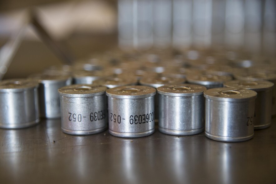 Squibs rest on an inspection table, March 31, 2016, at Moody Air Force Base, Ga. Squibs are small tubes filled with an explosive substance and can be used to generate mechanical force to ignite the chaff and flare which can be used by aircraft as a countermeasure during flight. (U.S. Air Force photo by Airman 1st Class Janiqua P. Robinson/Released)