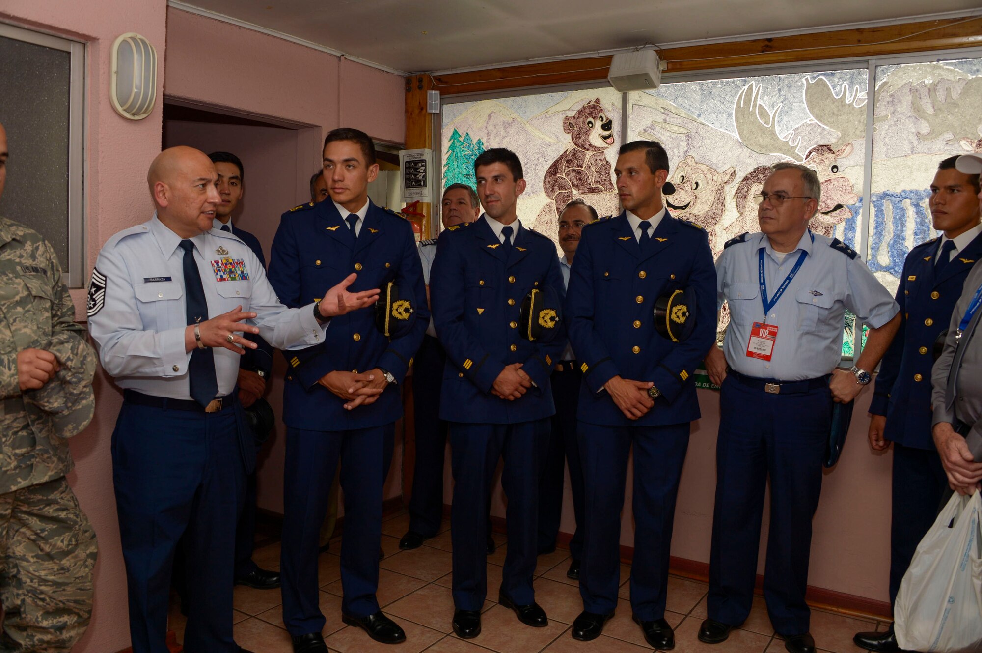 Chief Master Sgt. Jose Barraza, 12th Air Force (Air Forces Southern) Command Chief, speaks with some of the Chilean air force cadets about the importance of serving the community at the Fuerza Aerea de Chile Centro de Rehabilitacion Tantauco hospital in Santiago, Chile, March 31, 2016.  The cadets joined  members from the 12th Air Force (Air Forces Southern) FIDAE to spend some of their down-time visiting children in multiple hospitals.  (U.S. Air Force photo by Tech. Sgt. Heather Redman/Released)