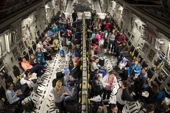 Dependents of military members from Incirlik Air Base, Turkey, wait to disembark from a C-17 Globemaster III after landing at Baltimore Washington International Airport, Md., April 1, 2016. Defense Department dependents in Adana, Izmir and Mugla, Turkey, were given an ordered departure by the State Department and Secretary of Defense. (U.S. Air Force photo/Staff Sgt. Andrew Lee)