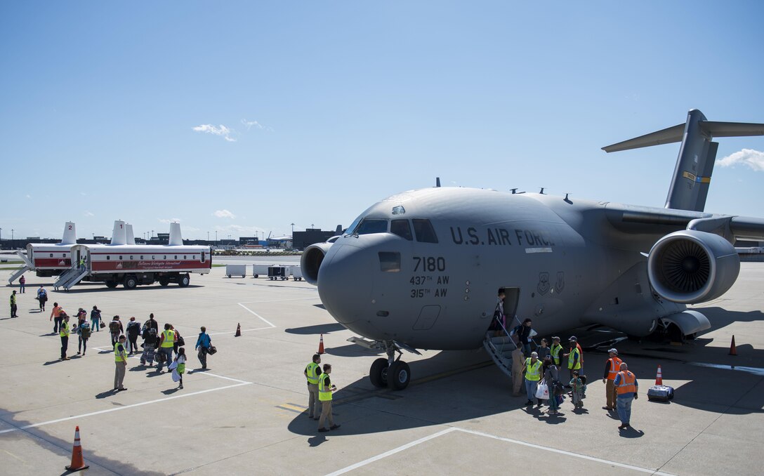 Dependents of military members from Incirlik Air Base, Turkey, disembark from a C-17 Globemaster III after landing at Baltimore Washington International Airport, Md., April 1, 2016. Defense Department dependents in Adana, Izmir and Mugla, Turkey, were given an ordered departure by the State Department and Secretary of Defense. The aircraft is assigned to the 437th Airlift Wing at Joint Base Charleston, S.C. (U.S. Air Force photo/Staff Sgt. Andrew Lee)
