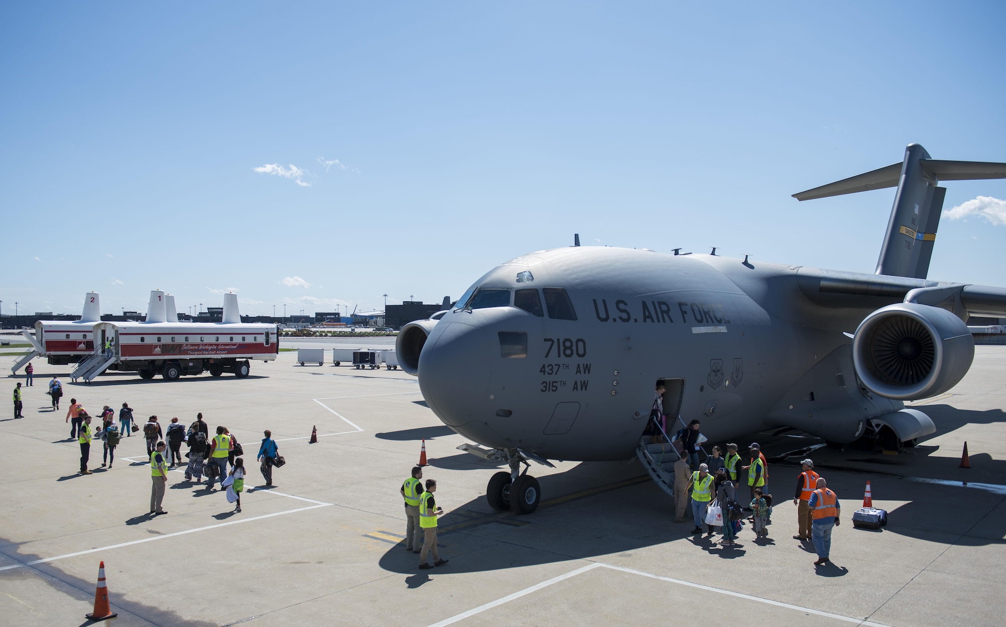 Dependents of military members from Incirlik Air Base, Turkey, disembark from a C-17 Globemaster III after landing at Baltimore Washington International Airport, Md., April 1, 2016. Defense Department dependents in Adana, Izmir and Mugla, Turkey, were given an ordered departure by the State Department and Secretary of Defense. The aircraft is assigned to the 437th Airlift Wing at Joint Base Charleston, S.C. (U.S. Air Force photo/Staff Sgt. Andrew Lee)