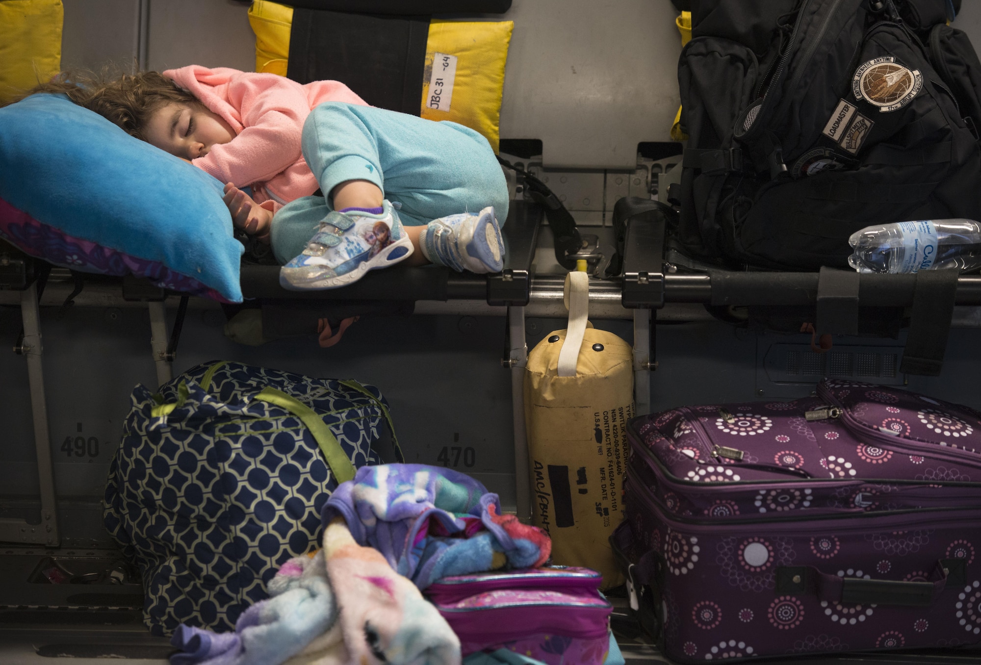 Amelia McNab, 2, sleeps on the seat inside of a C-17 Globemaster III at Baltimore Washington International Airport, Md., April 1, 2016. Amelia is the daughter of two military parents. Defense Department dependents in Adana, Izmir and Mugla, Turkey, were given an ordered departure by the State Department and Secretary of Defense. (U.S. Air Force photo/Staff Sgt. Andrew Lee)