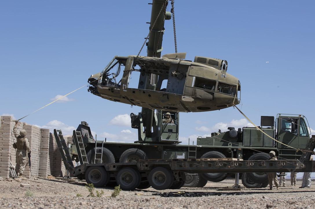 Marines conduct an aircraft salvage exercise during an instructor course at K-9 Village, Yuma Proving Grounds, Yuma, Ariz., March 30, 2016. The training emphasizes operational integration of the six functions of Marine Corps aviation to support a Marine Air Ground Task Force. Marine Corps photo by Lance Cpl. Anabel Abreu-Rodriguez
