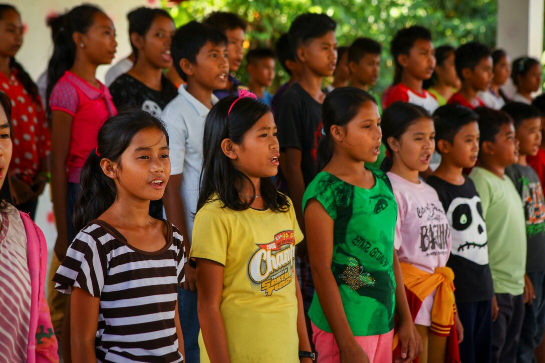 Students rehearse a school graduation at the Don Joaquin Artuz Memorial Elementary School one year after participating in Balikatan 2015 as a humanitarian civic assistance (HCA) site, in Tapaz, Philippines, March 31, 2016. U.S. and Philippine service members revisited the site to do a post assessment of the new two-room school building and other needed restorations as part of the HCA project. The Armed Forces of the Philippines and U.S. military have a longstanding relationship that has contributed to regional security and stability and is deeply rooted in cooperation. Balikatan, which means "shoulder to shoulder" in Filipino, is an annual bilateral training exercise aimed at improving the ability of Philippine and U.S. military forces to work together during planning, contingency and humanitarian assistance and disaster relief operations.