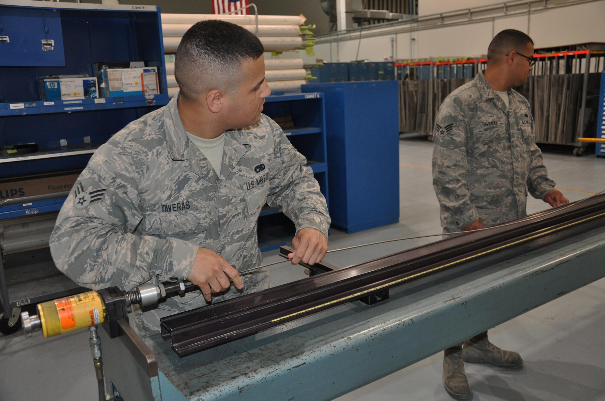 Twin brothers Senior Airman Carlos Taveras, left, an aircraft structural maintenance apprentice, and Senior Airman Emmanuel Taveras, an electrical and environmental journeyman, pose for a photo March 16, 2016. The brothers, from the Bronx, New York, deployed with the 379th Expeditionary Maintenance Squadron to Al Udeid Air Base, Qatar, in January. (U.S. Air Force photo/Tech. Sgt. James Hodgman)