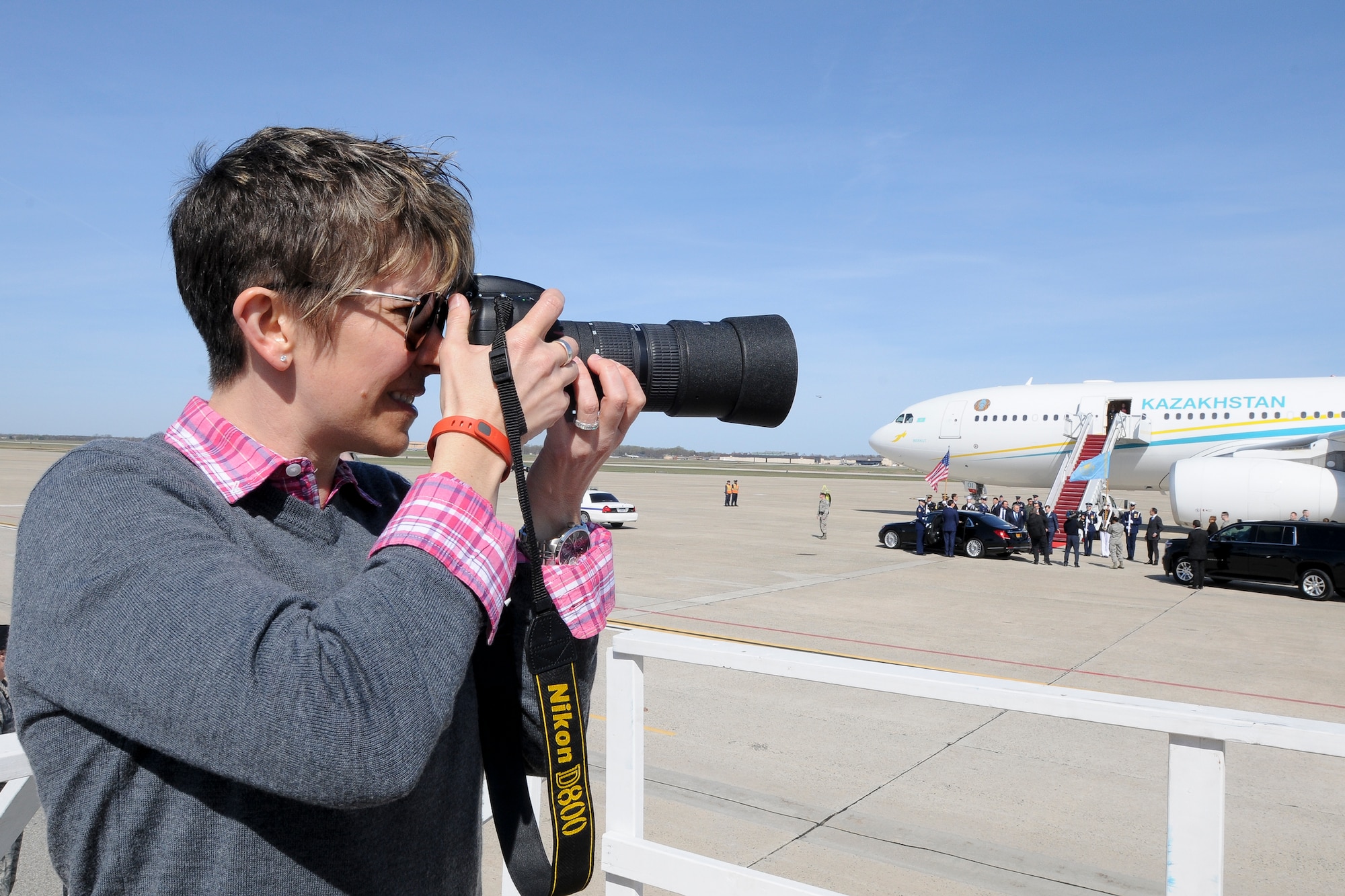 Technical Sgt. Erica Knight, 756th Air Refueling Squadron boom operator and Nuclear Security Summit volunteer, captures imagery during the arrival of the President of the Republic of Kazakhstan on the Joint Base Andrews, Md., flight line March 30. More than 20 international heads of state arrived here for the 2016 NSS held in Washington, D.C. The summit provides a forum for leaders to reinforce commitments to securing nuclear materials. (U.S. Air Force photo/Staff Sgt. Kat Justen)