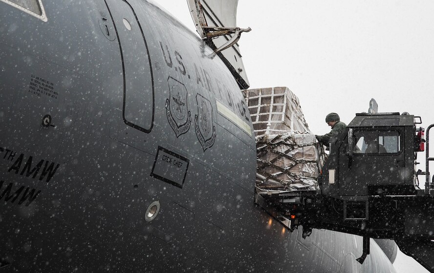Donated food items bound for Afghanistan are loaded on to a KC-10 or transport to Afghanistan. (Air Force Photo/Paul Zadach)
