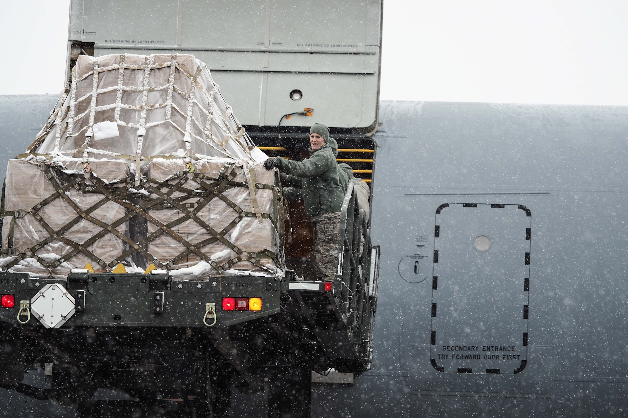 Donated food items bound for Afghanistan are loaded on to a KC-10 from McGuire AFB, New Jersey. (Air Force Photo/Paul Zadach)