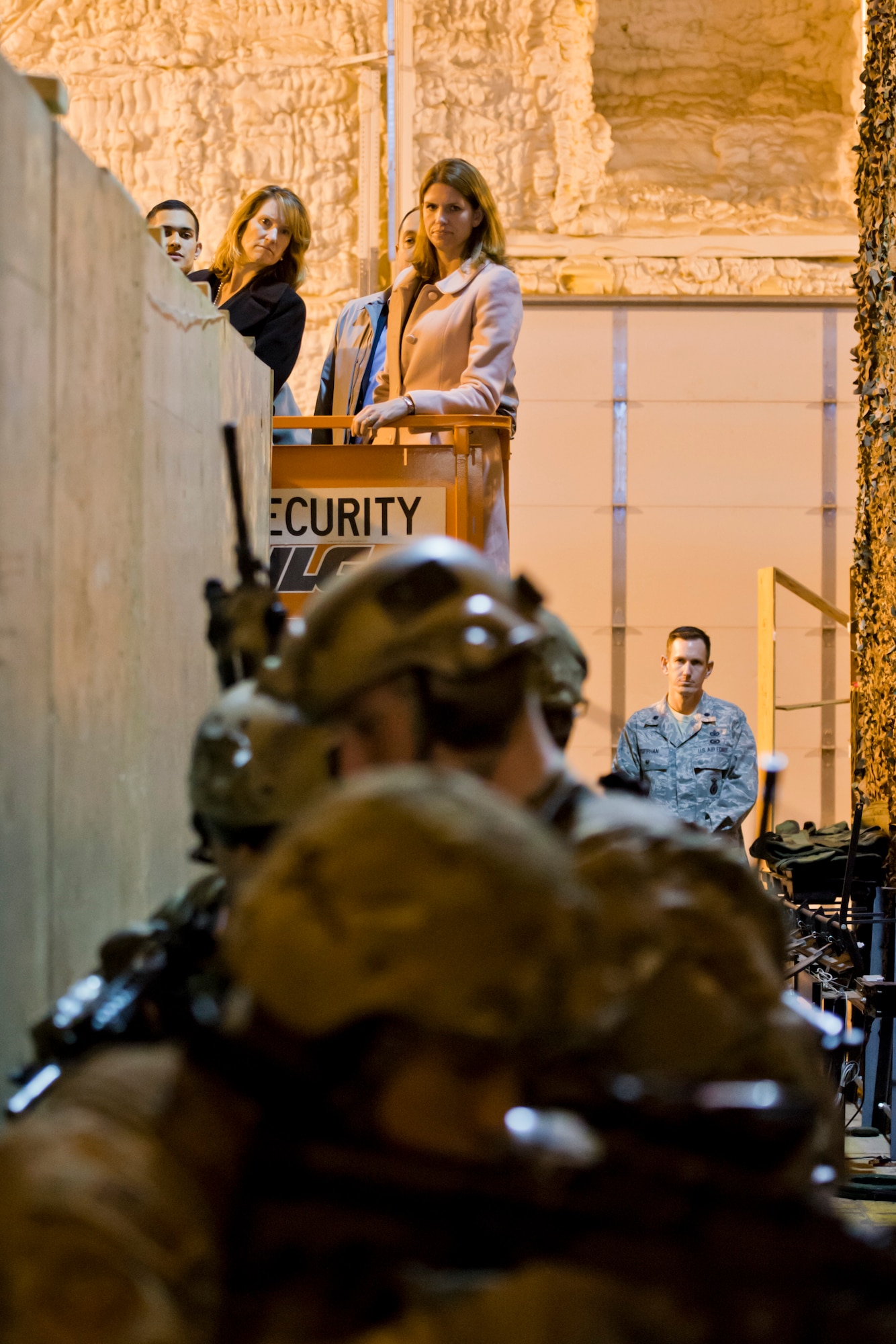 The honorable Lisa Disbrow, undersecretary of the Air Force, watches a demonstration by Tactical Response Force members at Minot Air Force Base, N.D., March 28, 2016. Disbrow and Lt. Gen. Jack Weinstein’s, deputy chief of staff for strategic deterrence and nuclear integration, visit included the 54th Helicopter Squadron, a Missile Alert Facility, Tactical Response Force and concluded at Dock 8. (U.S. Air Force photo/Airman 1st Class J.T. Armstrong)