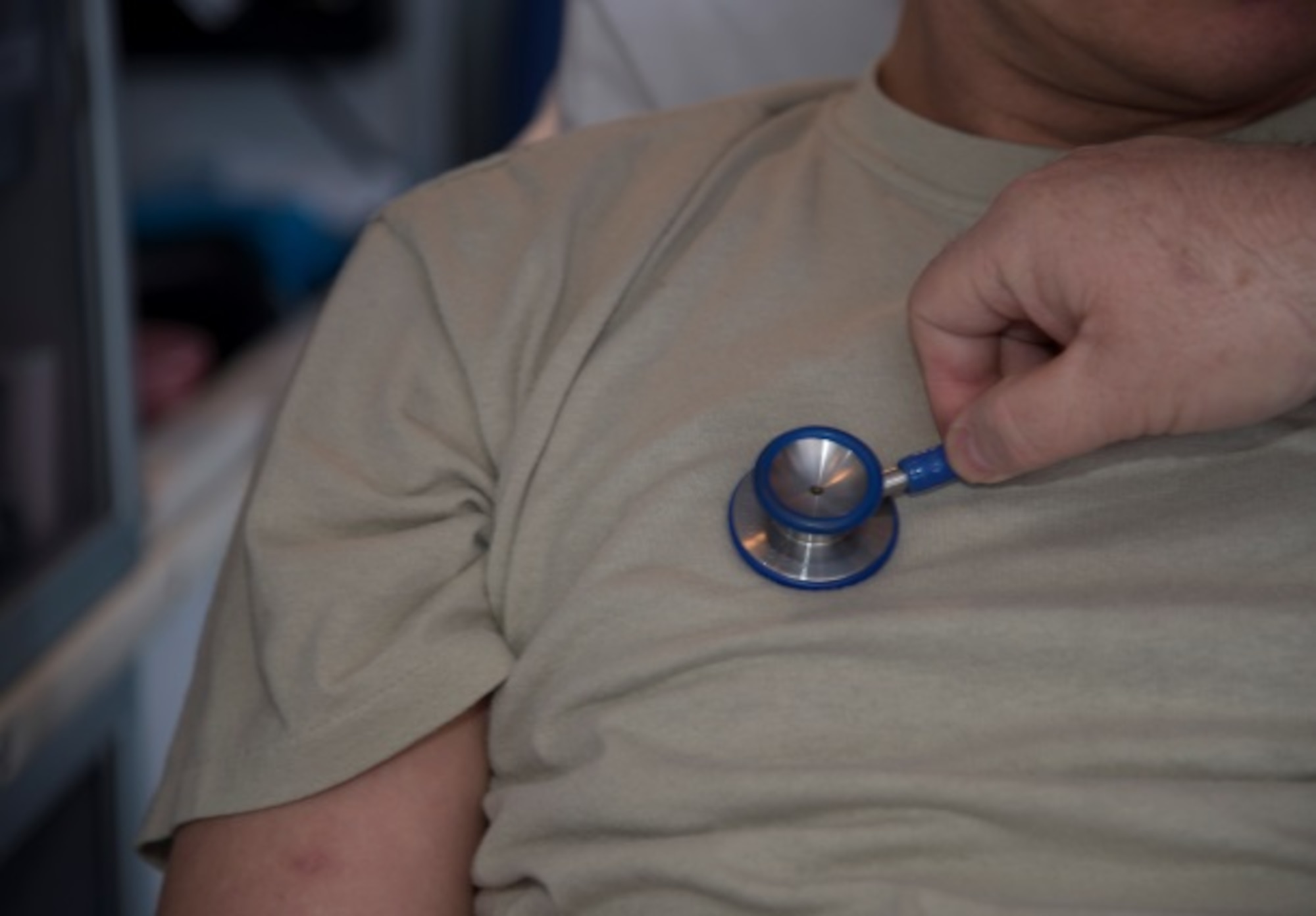 Gary August, 5th Medical Group field paramedic, checks the vitals of a patient during a simulated response at Minot Air Force Base, N.D., March 18, 2016. Personnel in August’s section are trained to work with LIFEPAK15 cardiac monitors, stair chairs, backboards and a host of other emergency medical equipment. (U.S. Air Force photo/Airman 1st Class Christian Sullivan)