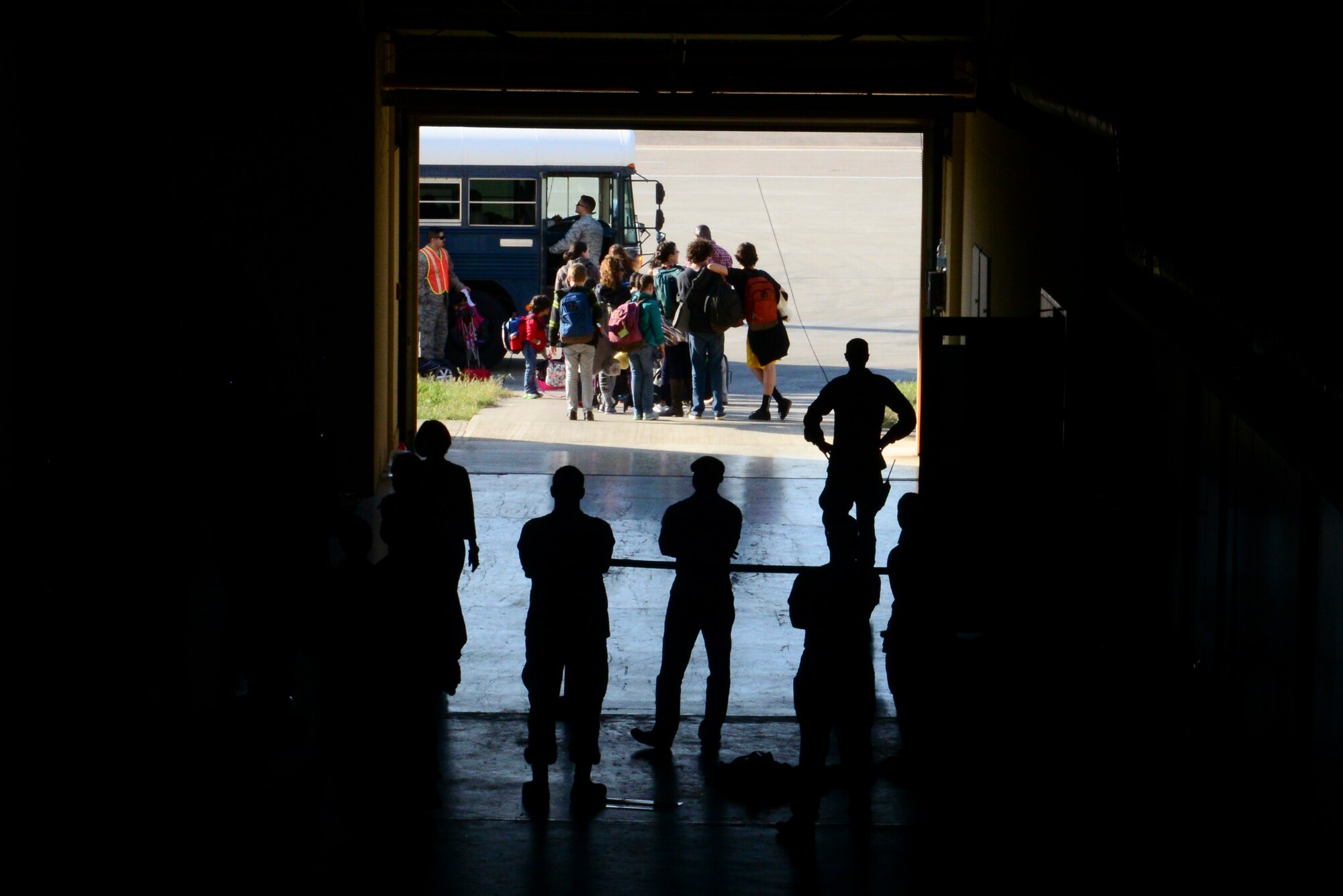 Families of U.S. Airmen and Department of Defense civilians board a bus to be shuttled to the passenger terminal, March 31, 2016, at Incirlik Air Base, Turkey. The Secretary of Defense, in coordination with the Secretary of State, ordered the departure of all Department of Defense dependents assigned to Incirlik Air Base. (U.S. Air Force photo by Staff Sgt. Caleb Pierce/Released)