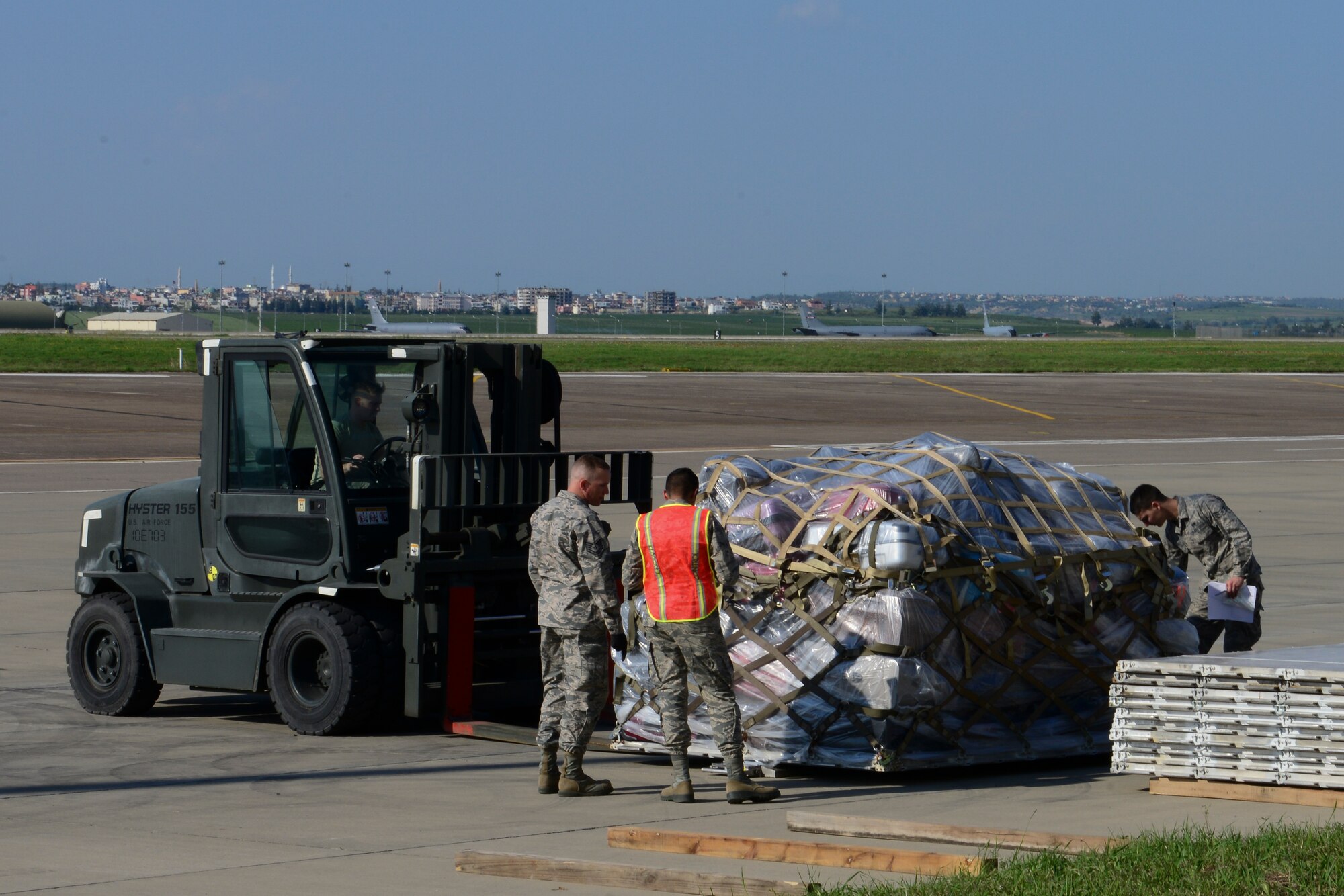Members of the 728th Air Mobility Squadron along with volunteers, stage a pallet of luggage during an ordered departure for dependents, March 31, 2016, at Incirlik Air Base, Turkey. The Secretary of Defense, in coordination with the Secretary of State, ordered the departure of all Department of Defense dependents assigned to Incirlik Air Base. (U.S. Air Force photo by Staff Sgt. Caleb Pierce/Released)