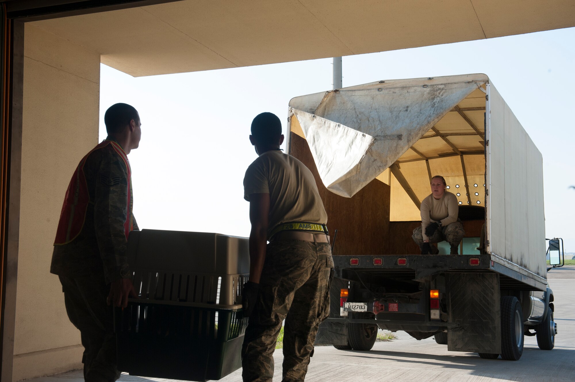 Pets are loaded into a truck for transport to an aircraft, March 31, 2016, at Incirlik Air Base, Turkey. The Secretary of Defense, in coordination with the Secretary of State, ordered the departure of all Department of Defense dependents along with their pets, assigned to Incirlik Air Base. (U.S. Air Force photo by Tech. Sgt. Joshua Jasper/Released)