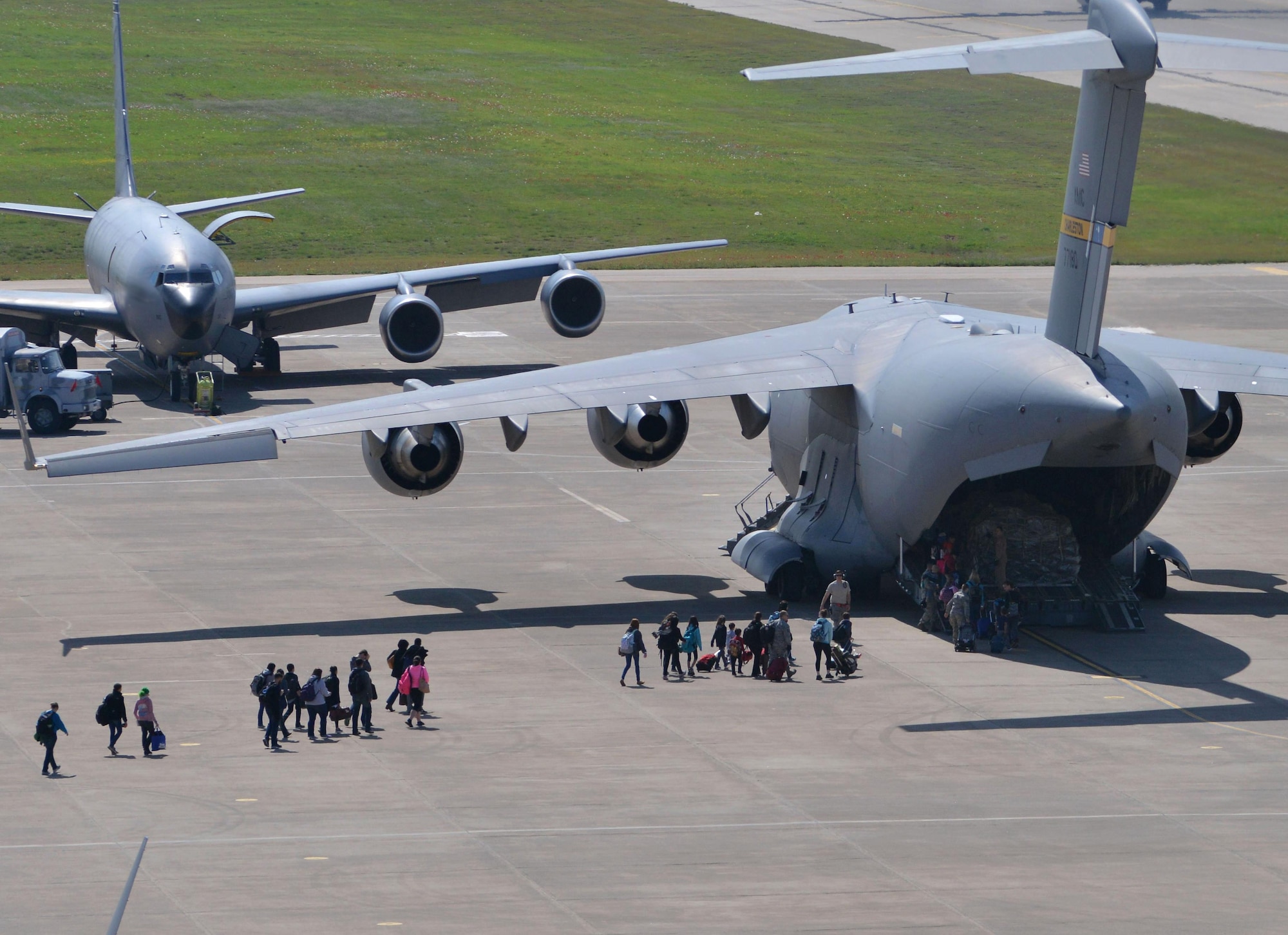 Families of U.S. Airmen and Department of Defense civilians board a C-17 Globemaster III during an ordered departure, March 30, 2016, at Incirlik Air Base, Turkey. On March 29, 2016, the Secretary of Defense, in coordination with the Secretary of State, ordered the departure of all DOD dependents assigned to Incirlik Air Base. (U.S. Air Force photo by Senior Airman John Nieves Camacho/Released)