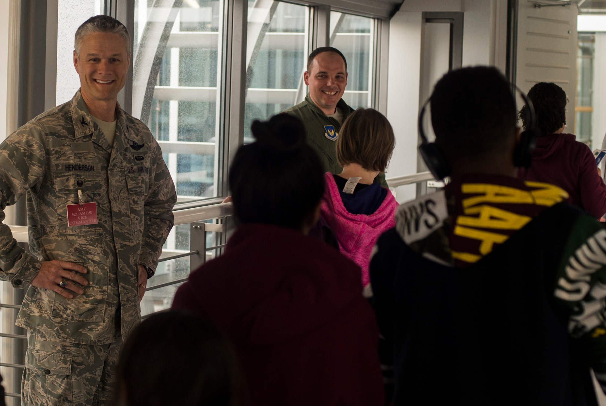 Col. Charles Henderson, 521st Air Mobility Operations Wing vice commander, greets families arriving from Turkey March 30, 2016, at Ramstein Air Base, Germany.  Ramstein was designated as a ‘transition location’ for families to await travel to their subsequent duty locations. However, a number of families will relocate to Ramstein for an extended period of time. (U.S. Air Force photo/Senior Airman Jonathan Stefanko)